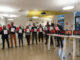 Représentants FSU, UNSA, CFDT, avec carton rouge et bâillon à l'entrée du CSA de l'AEFE.